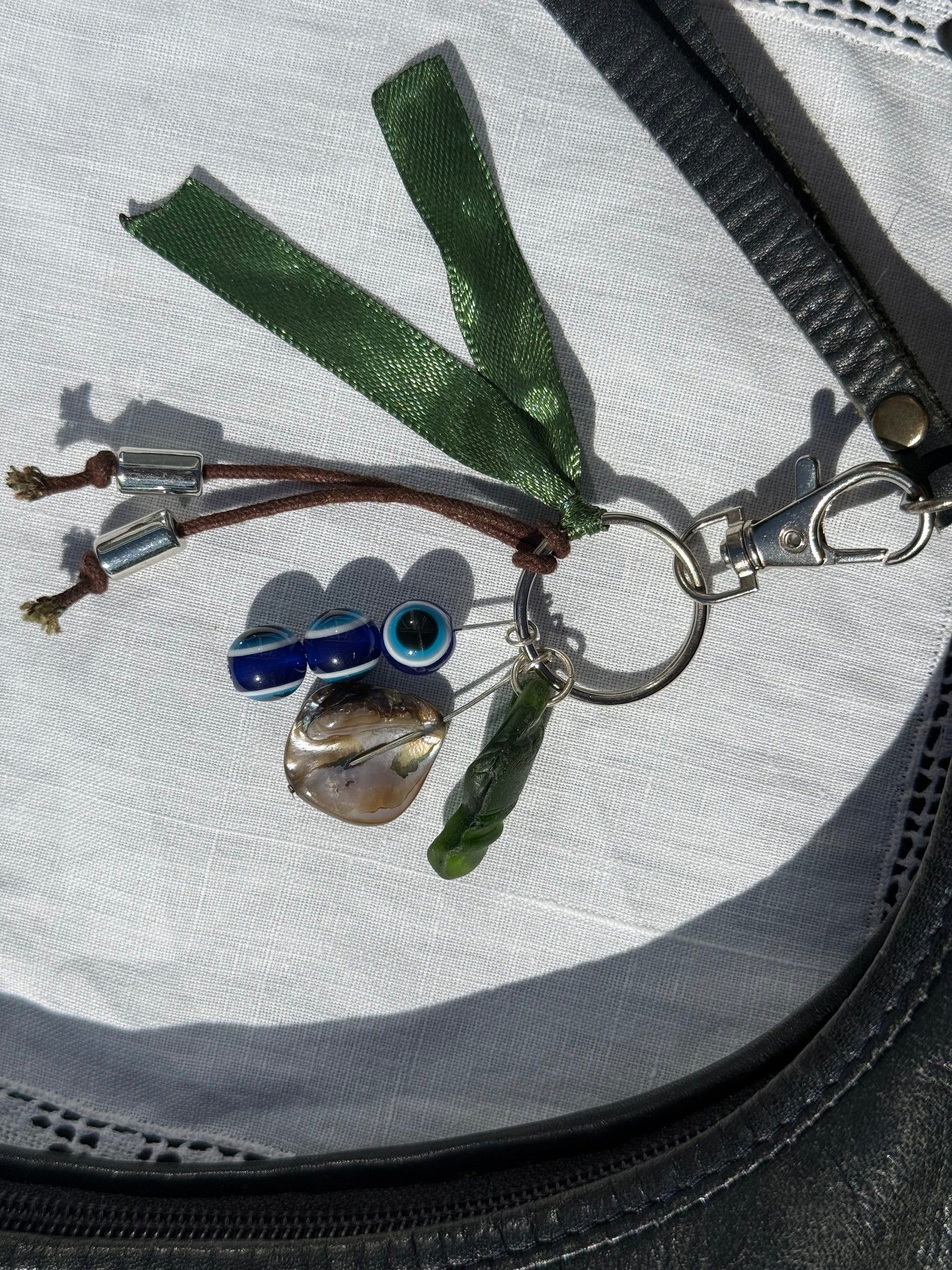 Keychain with various charms on a textured surface