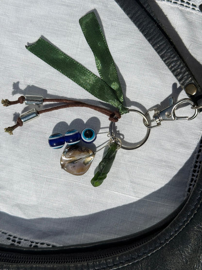Keychain with various charms on a textured surface