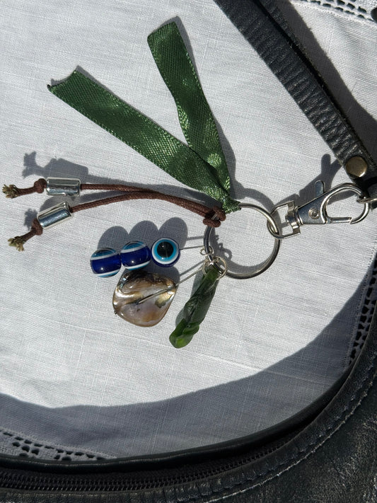Keychain with various charms on a textured surface